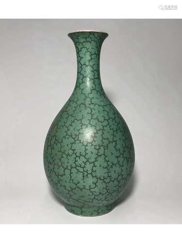 A CELADON CARVED YUHUCHUN VASE