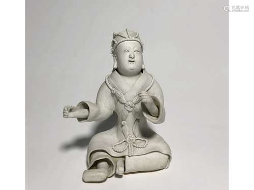 A WHITE GLAZED FIGURE