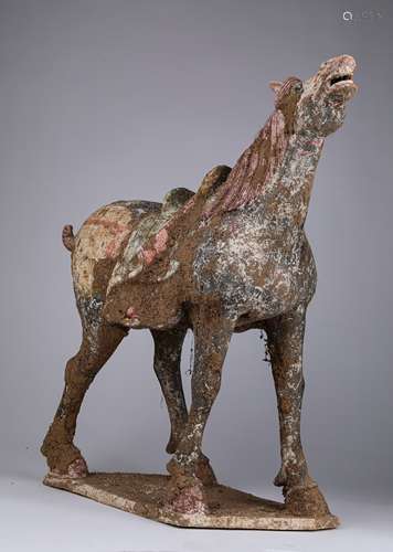 A TANG DYNASTY COLORED CERAMIC HORSE SHAPE ORNAMENT