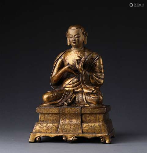 A MING DYNASTY GILTING BRONZE GURU STATUE