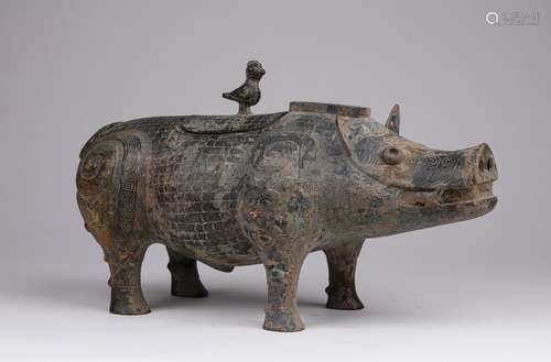 A WARRING STATES PERIOD BRONZE PIG SHAPE ORNAMENT