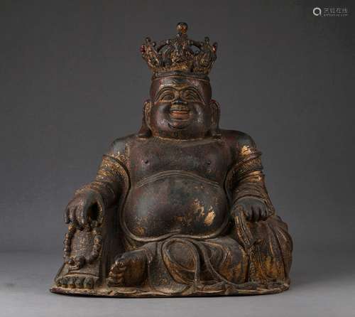 A MING DYNASTY MAITREYA STATUE