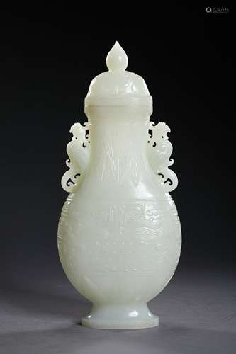 A QING DYNASTY CARVED WHITE JADE BOTTLE