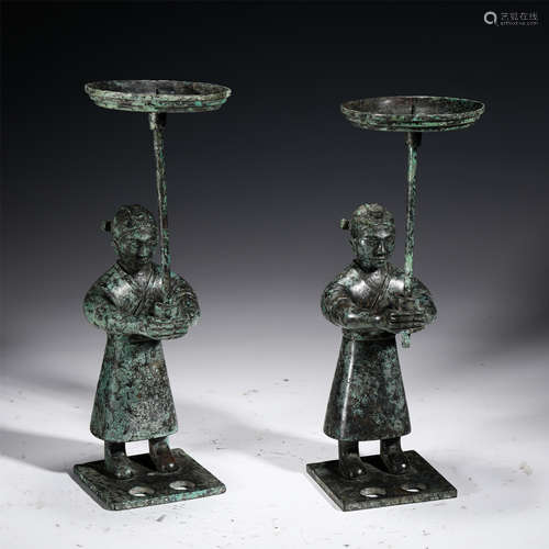 A PAIR OF CHINESE BRONZE FIGURE SHAPED CANDLE HOLDERS