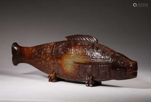 A WARRING STATES PERIOD CARVED JADE FISH SHAPE ORNAMENT