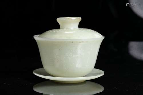 A QING DYNASTY CARVED HETIAN CUP WITH LID