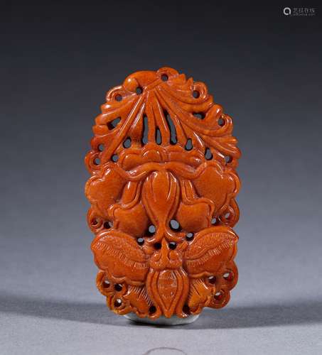 A QING DYNASTY CARVED BEEWAX PENDANT