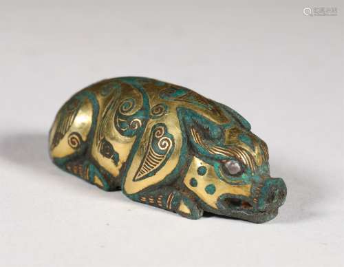 A WARRING STATES PERIOD GOLD INLAID BRONZE PIG SHAPE ORNAMENT