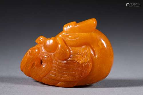 A QING DYNASTY CARVED BEEWAX PENDANT