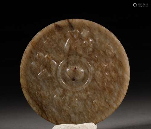 A WARRING STATES PERIOD CARVED JADE MIRROR