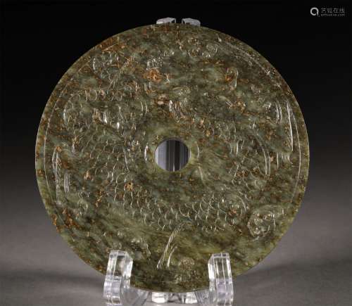 A TANG DYNASTY CARVED JADE CHARACTER PATTERN MIRROR