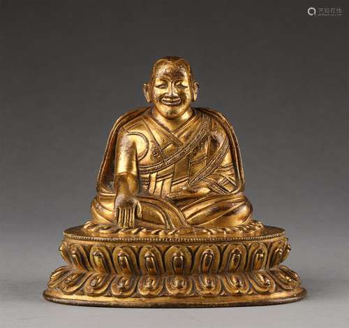 A MING DYNASTY GILTING BRONZE GURU STATUE