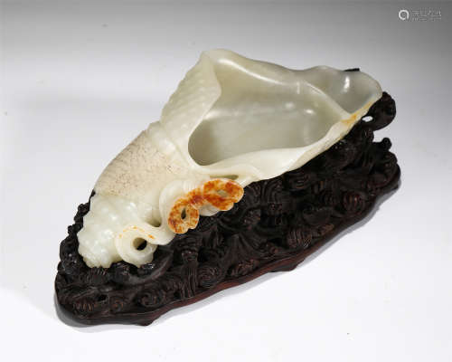 CHINESE JADE CONCH SHAPED ORNAMENT ON HARDWOOD STAND