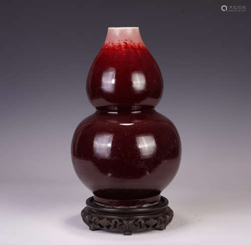 A CHINESE WARE RED GLAZE GOURD VASE