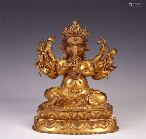 A CHINESE GILT BRONZE BUDDHIST GUARDIAN SEATED STATUE