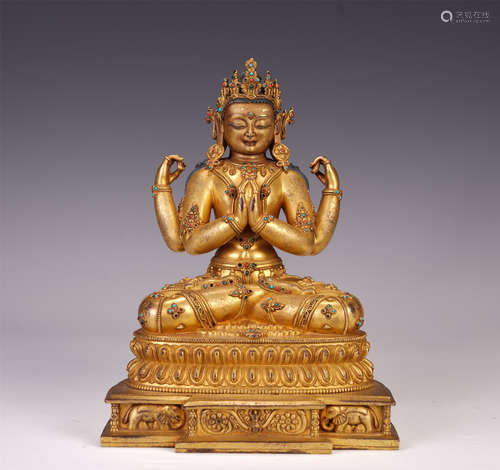 A CHINESE GILT BRONZE FOUR ARMS GUANYIN SEATED STATUE