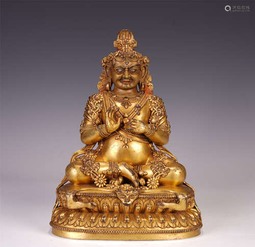 A CHINESE GILT BRONZE JAMBHALA SEATED STATUE