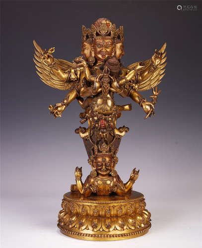 A CHINESE GILT BRONZE BUDDHIST GUARDIAN STATUE