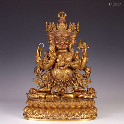 A CHINESE GILT BRONZE BUDDHIST GUARDIAN STATUE