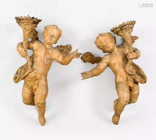 Two hovering angels with candlestic