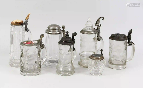 7 glass jugs with tin lid mounting,
