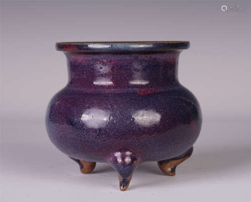 A CHINESE WARE RED GLAZE TRIPOD CENSER