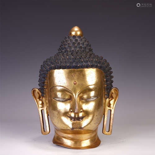 A CHINESE GILT BRONZE BUDDHA HEAD