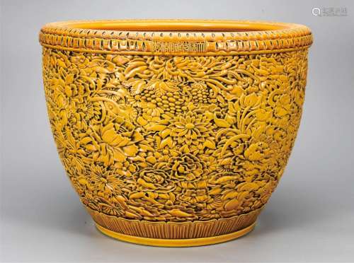 黄釉雕刻花开富贵缸