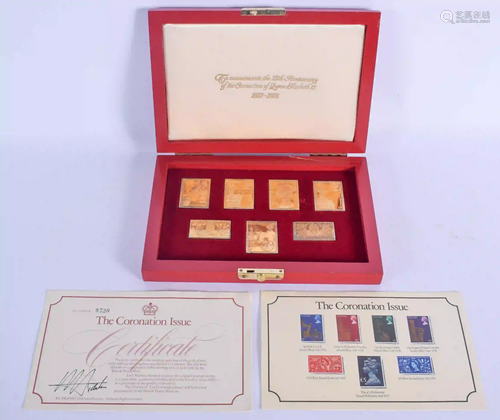 A SET OF CORONATION ISSUE GOLD PLATED SILVER STAMPS.