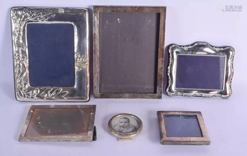 SIX SILVER PHOTOGRAPH FRAMES. Largest 26 cm x 19 cm.