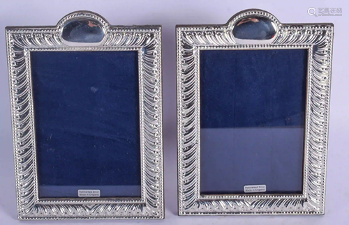 A PAIR OF SILVER PHOTOGRAPH FRAMES. 20 cm x 17…