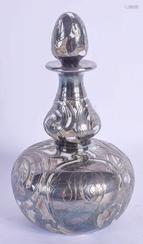 AN ART NOUVEAU SILVER OVERLAID SCENT BOTTLE AND STOP…