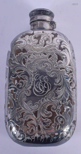 AN ART NOUVEAU SILVER OVERLAID HIP FLASK overlaid with