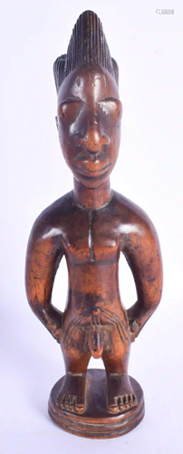 A FINE MALE IBEJI TWIN FIGURE modelled in the style of