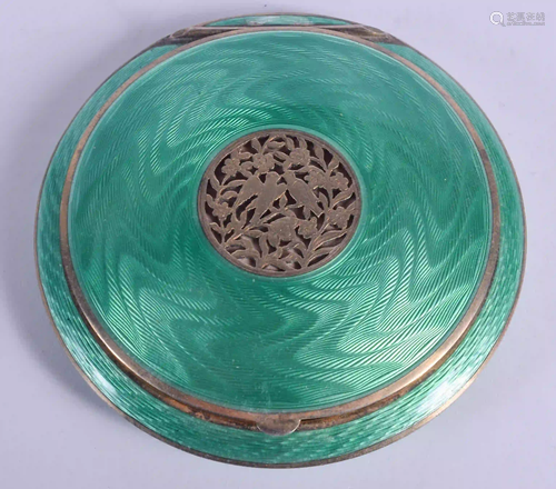 AN ART DECO SILVER AND ENAMEL BIRD COMPACT. 119 grams.