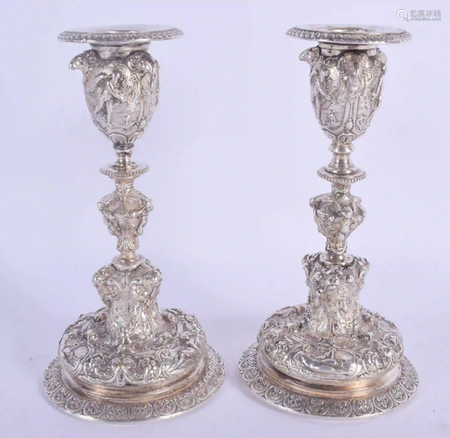 A PAIR OF 19TH CENTURY SILVER PLATED CANDLESTICKS