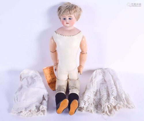 AN ANTIQUE ERNST HEUBACH BISQUE HEADED DOLL with dress.