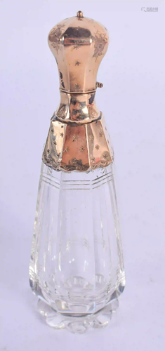 AN 18CT GOLD MOUNTED GLASS SCENT BOTTLE. 9 cm high.