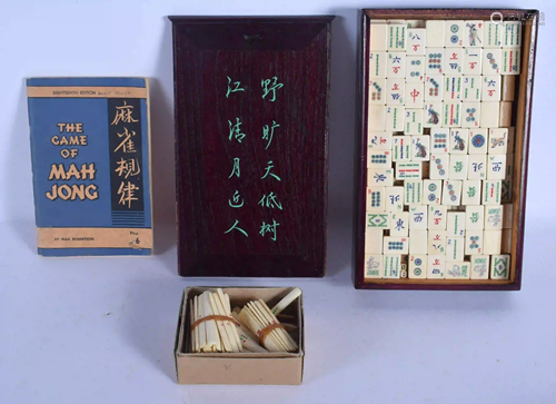 A VINTAGE CHINESE CASED MAHJONG SET with book. (qty)