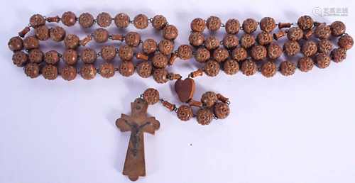 AN ANTIQUE CONTINENTAL NUT NECKLACE. 180 cm long.