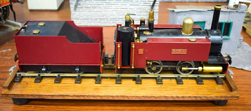 A BOXED LOCOMOTIVE TRAIN Robin, with tender, upon an