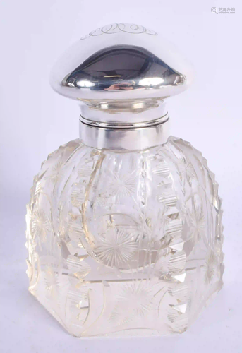 A SILVER MOUNTED CUT GLASS INKWELL. 15 cm high.