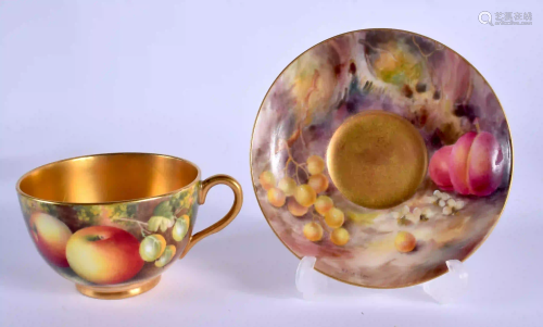 A ROYAL WORCESTER CUP AND SAUCER painted with fruit by