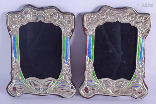 A PAIR OF SILVER AND ENAMEL PHOTOGRAPH FRAMES. 19 cm x