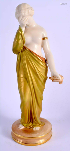 A ROYAL WORCESTER SHOT GOLD FIGURE OF SORROW, green