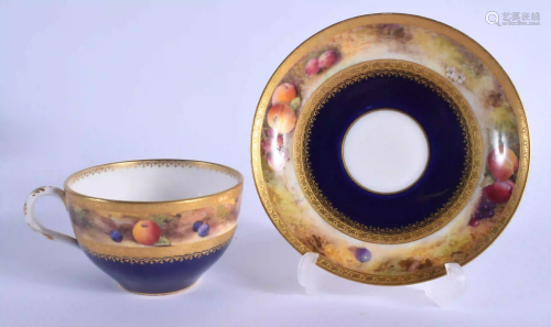 A ROYAL WORCESTER TEACUP AND SAUCER painted with a band