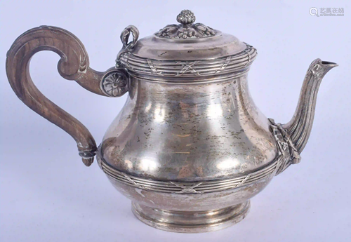 A 19TH CENTURY FRENCH SILVER TEAPOT embossed with