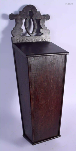 AN ANTIQUE OAK CANDLE BOX. 47 cm x 15 cm.