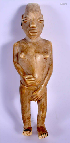 A 19TH CENTURY AFRICAN TRIBAL CARVED BONE FIGURE OF A