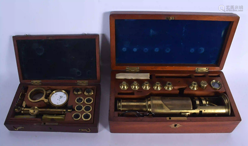 TWO ANTIQUE BRASS FIELD MICROSCOPES in fitted boxes.